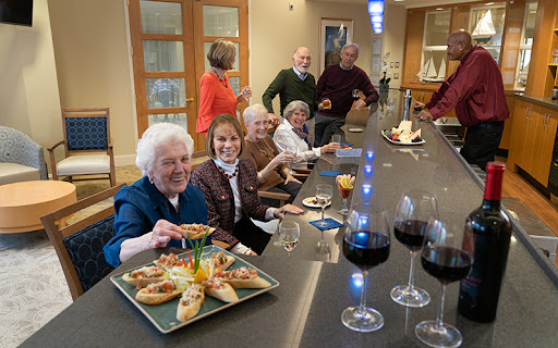 Ginger Cove residents at a wine and cheese night