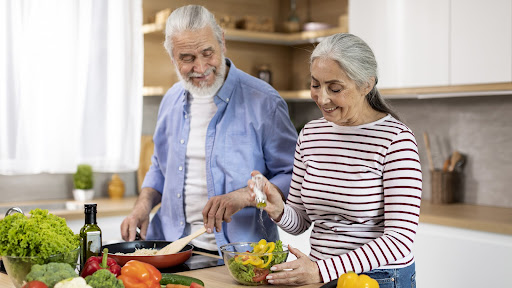 seniors preparing a healthy meal at home without any foods to avoid after 60