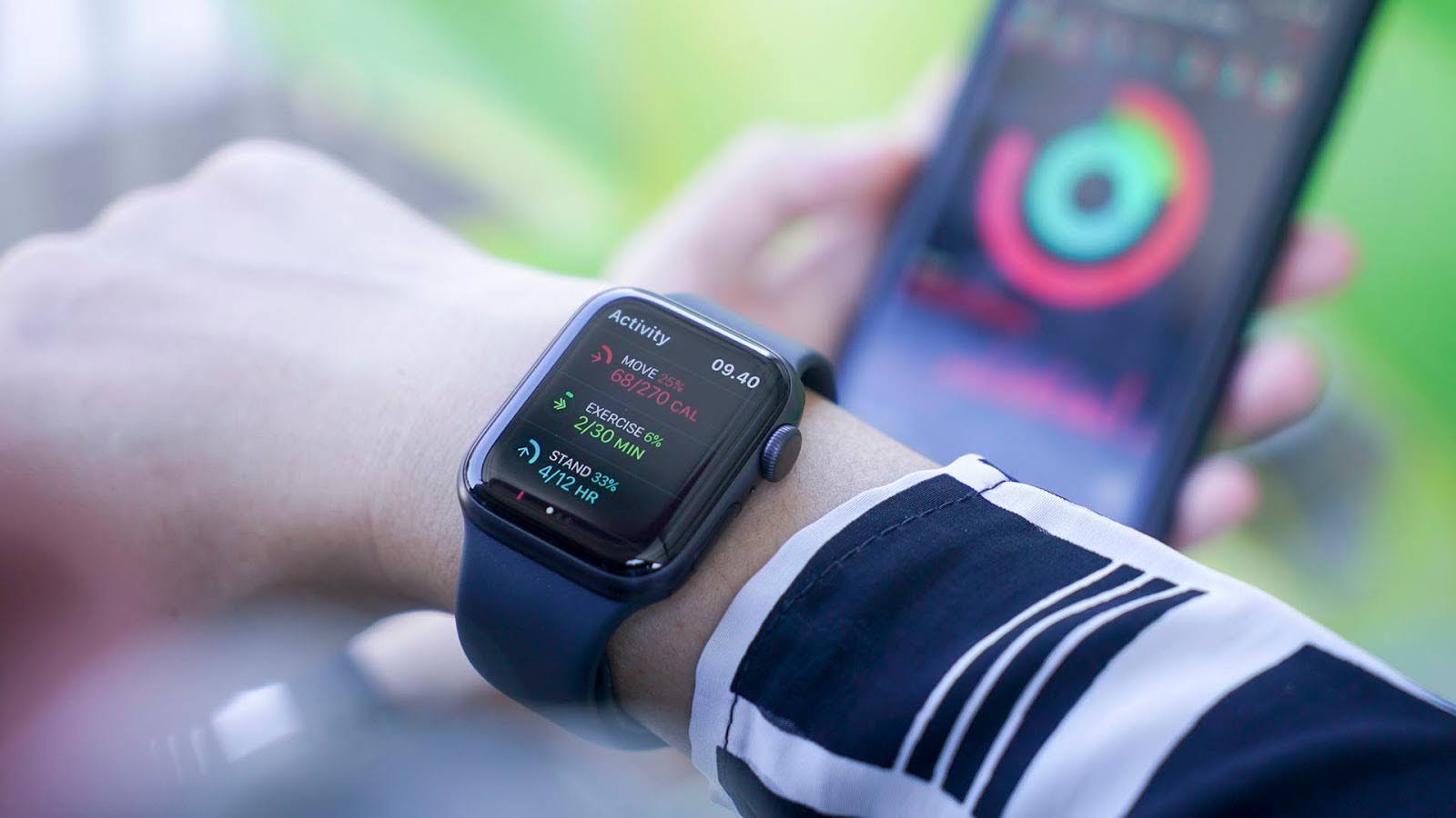 Woman using smart apple watch and smart phone, Apple watch