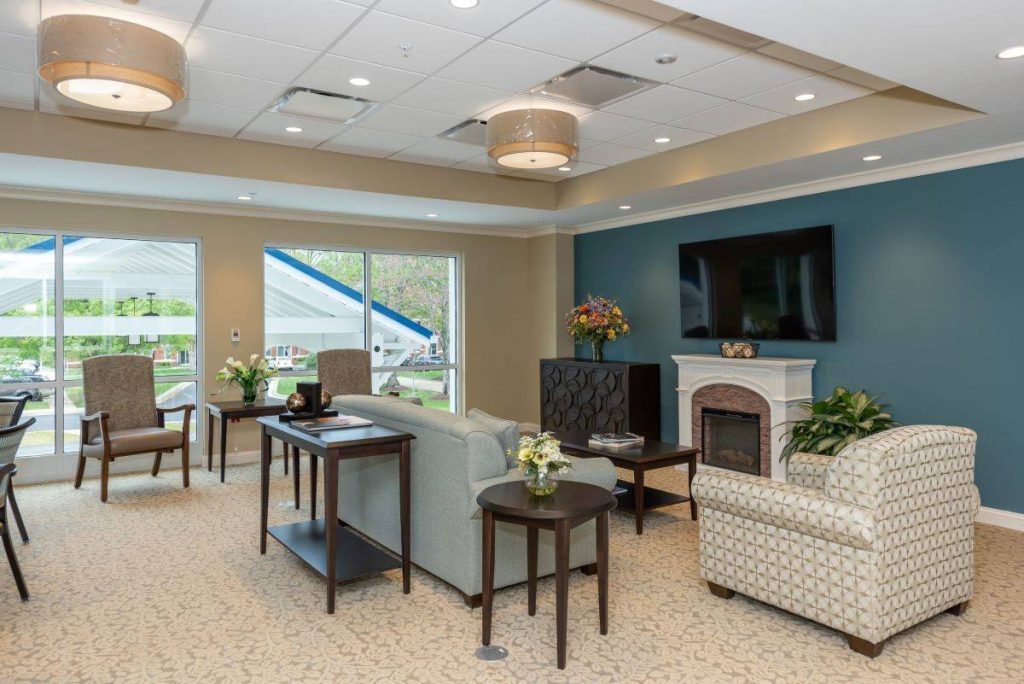 Ginger Cove Independent Living common area with fireplace and tv