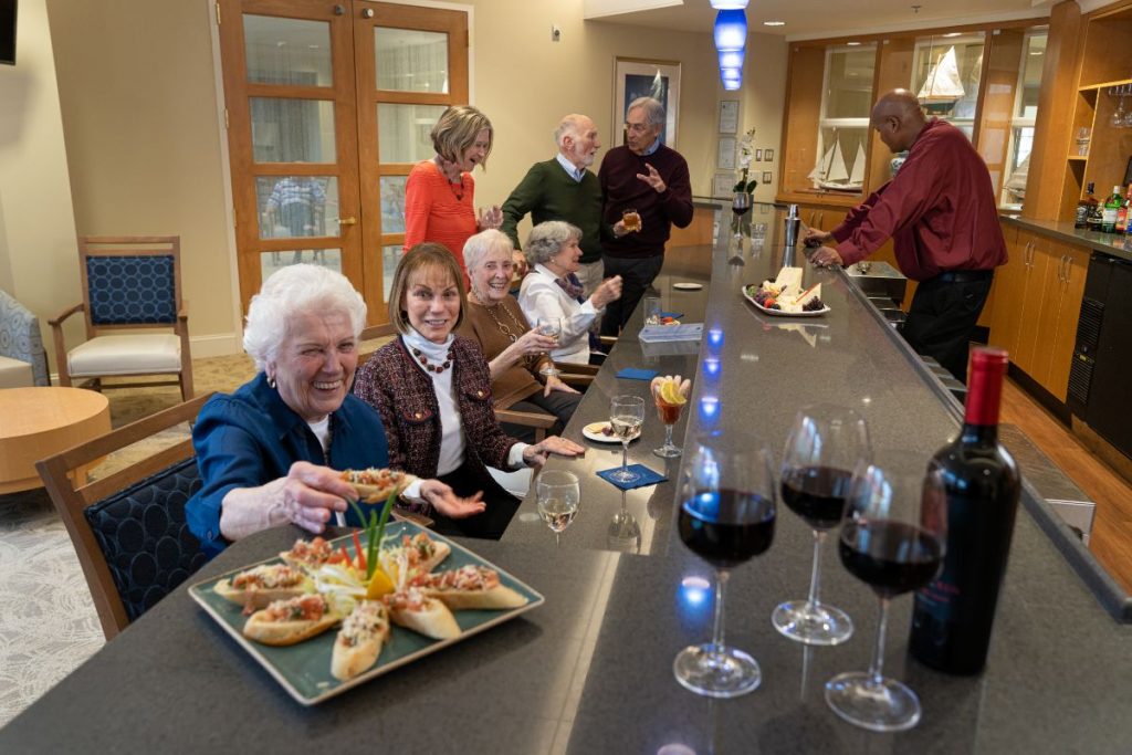 Ginger Cove residents enjoying appetizers at the Bugeye Bar