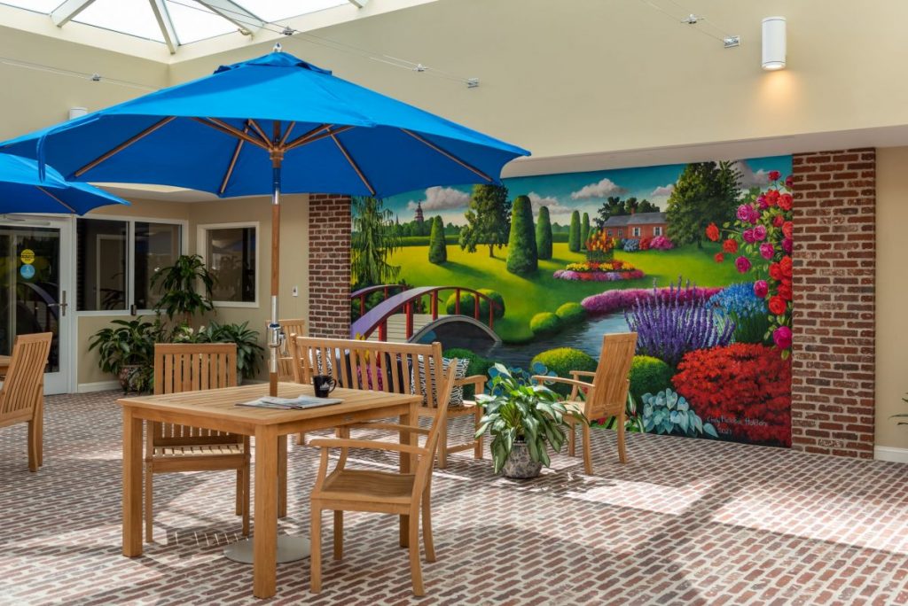 Ginger Cove Independent Living common area with sunroof and mural