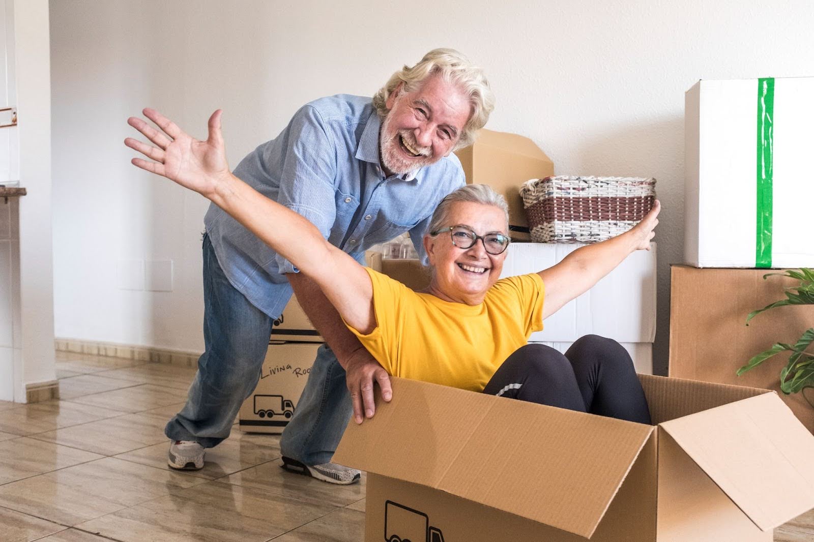 Senior couple packing for a move