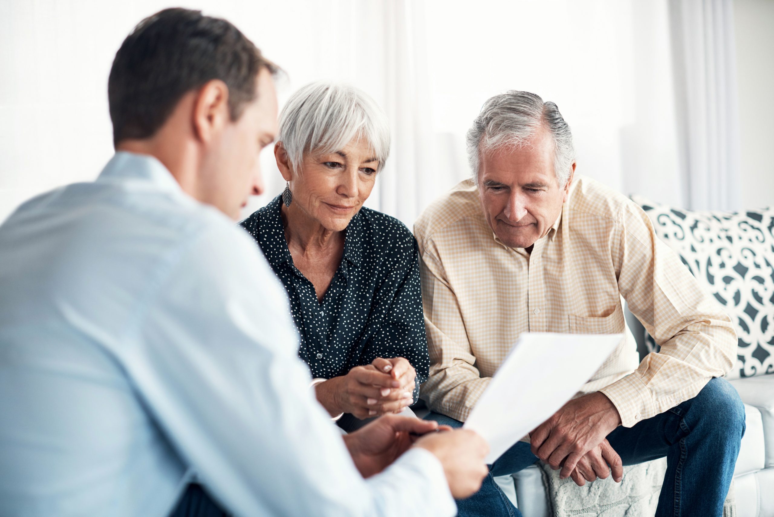 Shot of a senior couple getting advice from their financial consultant at home