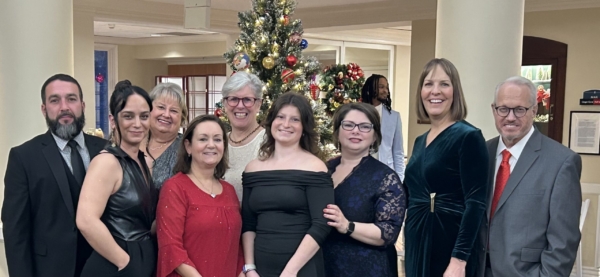 Ginger Cove employees smiling at Christmas party