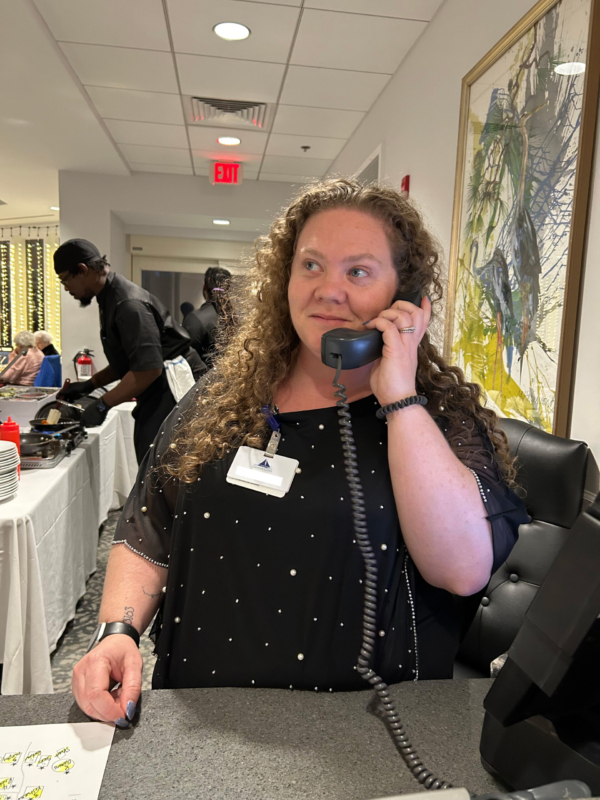 Ginger Cove employee answering phone