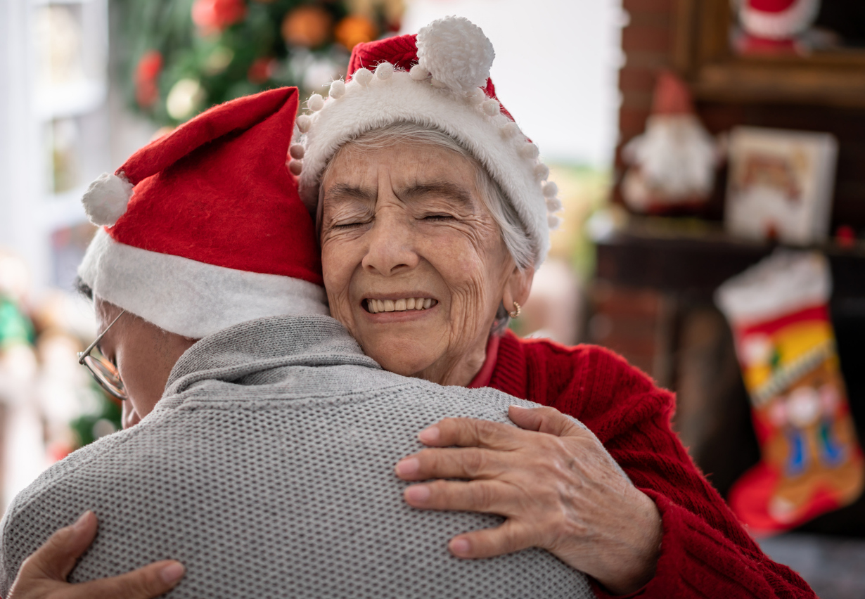 Annapolis grandmother hugging grandson at home for the holidays
