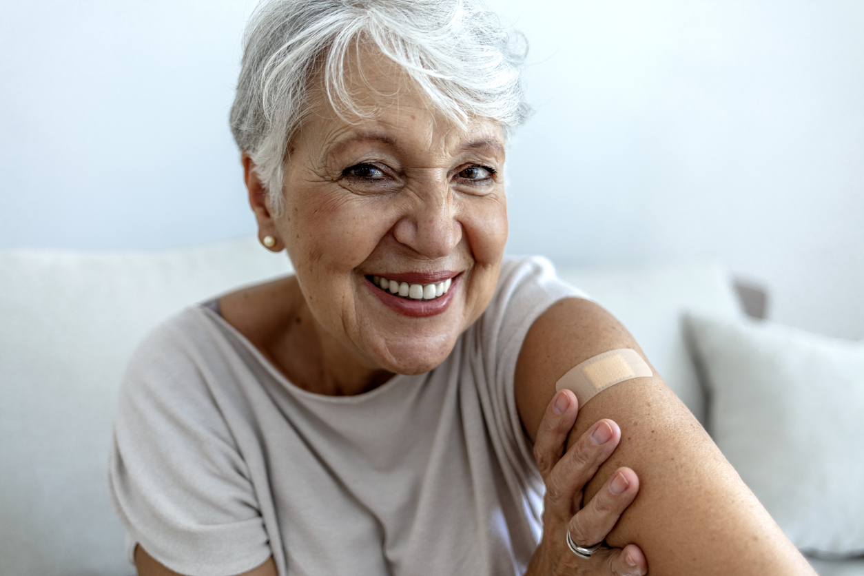 Senior Annapolis, MD woman getting immunization via anti-viral vaccine. Boost your immune system with cold and flu vaccinations.
