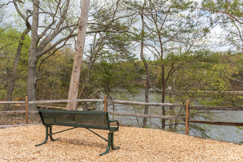 Ginger Cove bench facing Gingerville Creek