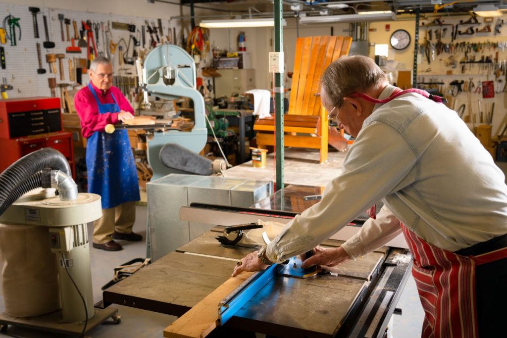 Ginger Cove residents working in woodshop