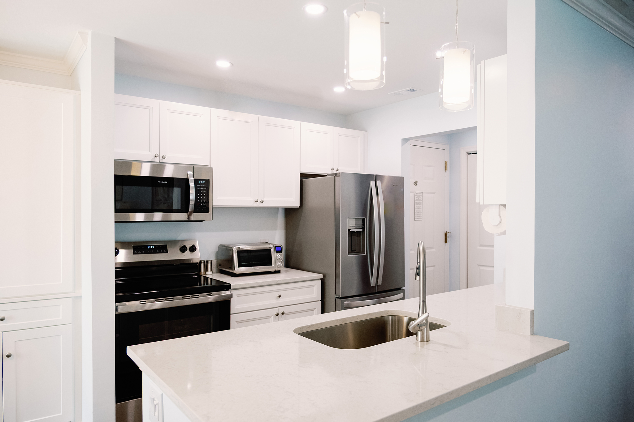 Ginger Cove resident apartment kitchen, featuring fridge and stove