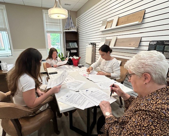 Ginger Cove employees reviewing documents