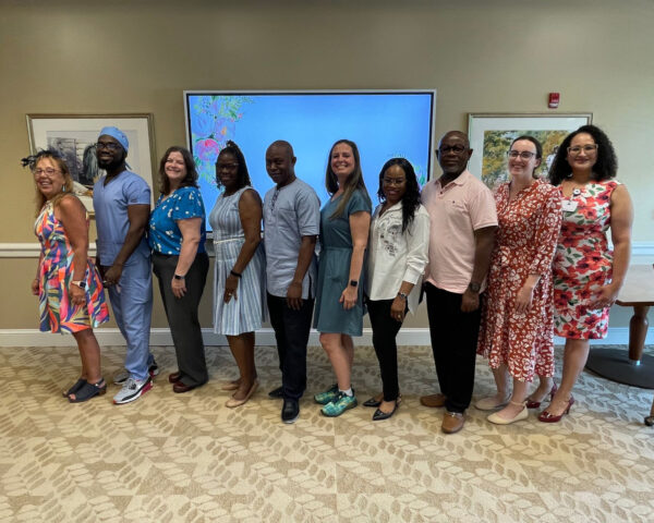 Ginger Cove nurses smiling and posing in row