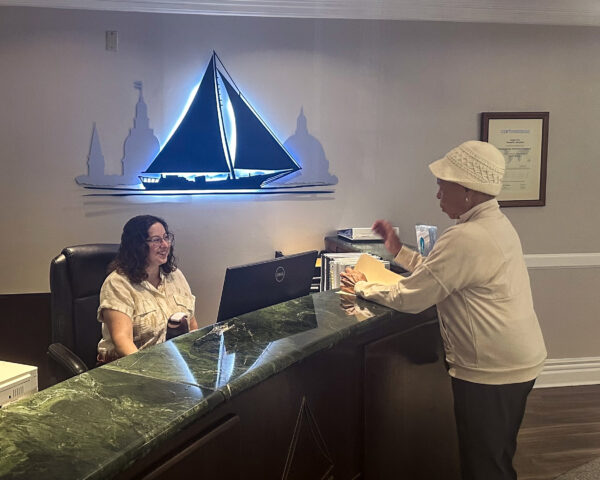 Ginger Cove front desk attendent smiling