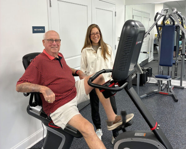 Ginger Cove physical therapist smiling with resident