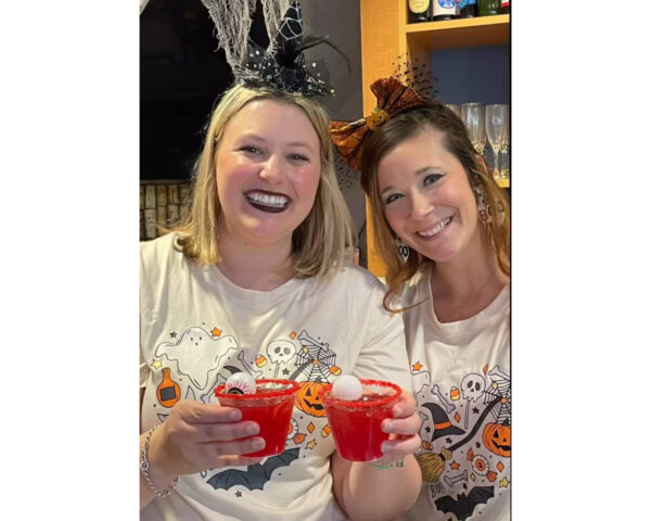 Ginger Cove employees smiling at Halloween party