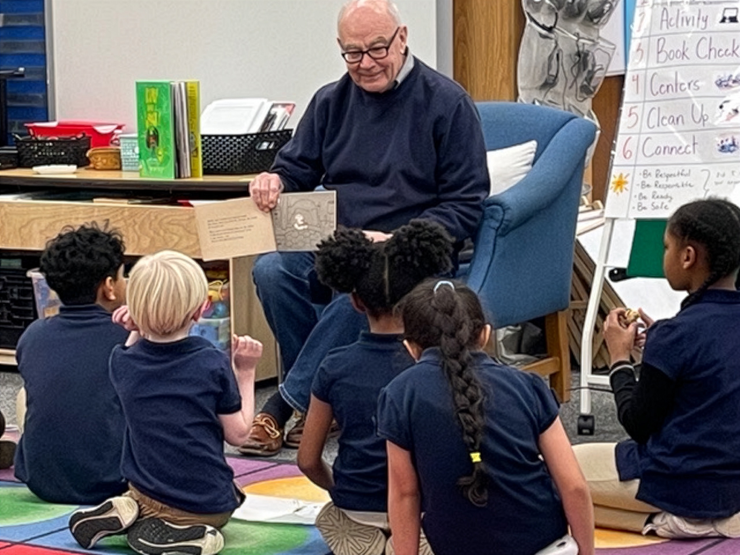 Doug Smith reading to children in STAIR program.
