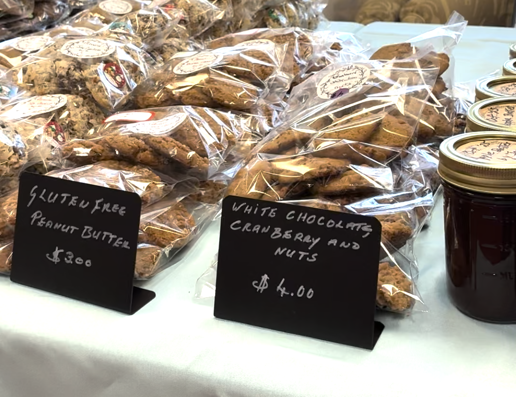 A table holding cookies and jam from Ginger Cove's holiday Bazaar